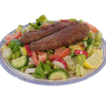 Grilled beef kofta kabobs paired with a healthy green salad