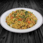 Hearty Halal beef biryani rice dish on a dark wood table