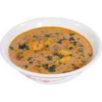 Richly spiced Halal lamb korma stew in a white bowl